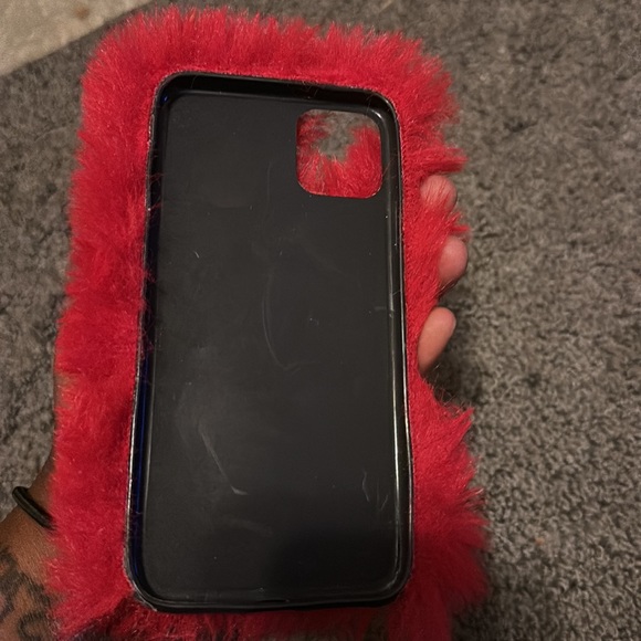 This is a fuzzy red case for a iPhone 11 pro max. There is a few little scratch. - Picture 2 of 4